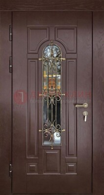 Темная железная дверь со стеклом и ковкой для частного дома ДСК-156 в Электрогорске